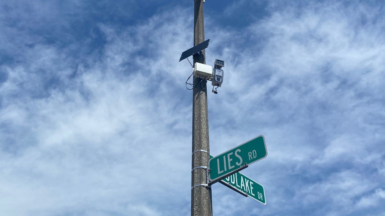 Frost Solutions road weather station mounted on a street-sign pole